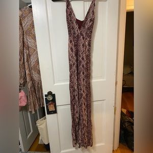 Funky, purple snakeskin jumpsuit - perfect for resort wear